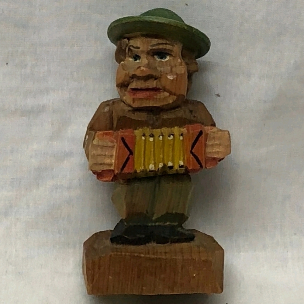 This Vintage ANRI Carved Wood Musician Statue from Italy is a unique and charmin